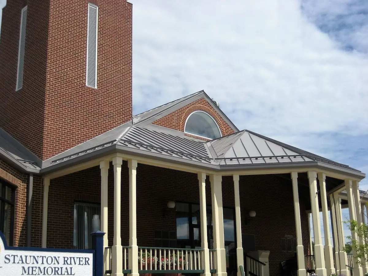 Skilled roofing craftsmen working on a residential roof in Saybrook